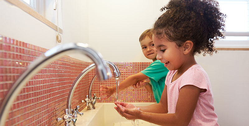 image of children washing hands